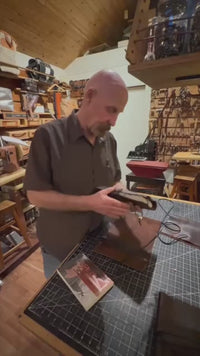 Leather  Book Cover with a book.  1984, Wind in The Willows, Dylan Thomas Poems or  Animal Farm